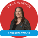 Tracy Brooks receives the Passion Award for her unwavering dedication to her team, handling thousands of calls and emails with heart and enthusiasm.