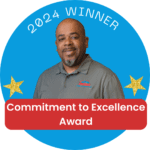 Reggie Patton receives the Commitment to Excellence Award, recognizing his dedication to professionalism, thorough inspections, and outstanding service to clients.