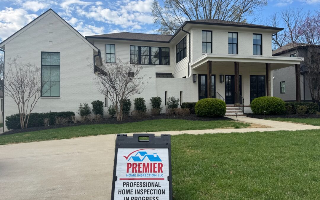 Home inspection sign in front of potential home for a client.